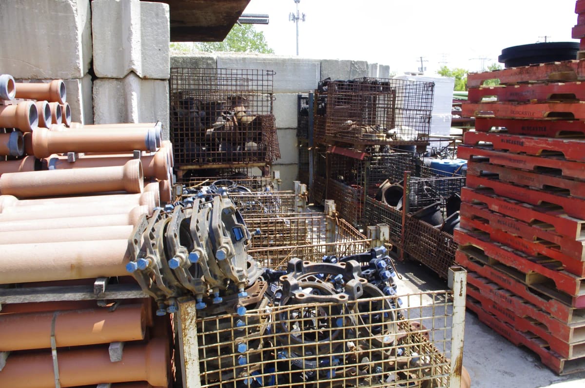 Water main fittings arranged in a material supply yard