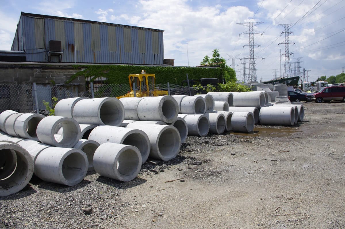 Precast concrete inlet structure in a materials yard